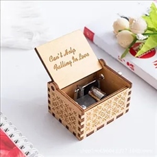 Wooden hand-cranked music box