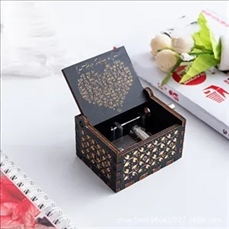 Wooden hand-cranked music box