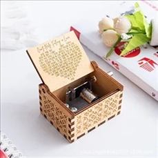 Wooden hand-cranked music box